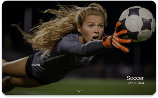 Female soccer goalie diving to catch ball